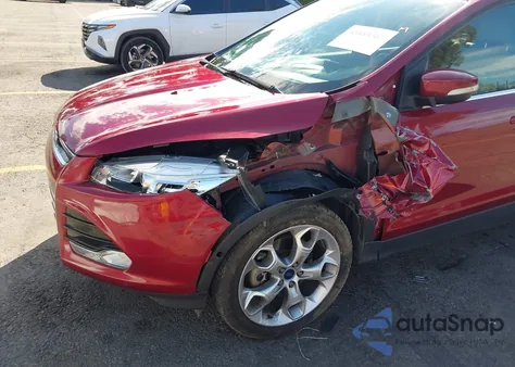 2016 Ford Escape Titanium z USA, uszkodzony, nr VIN 1FMCU0J91GUA39760